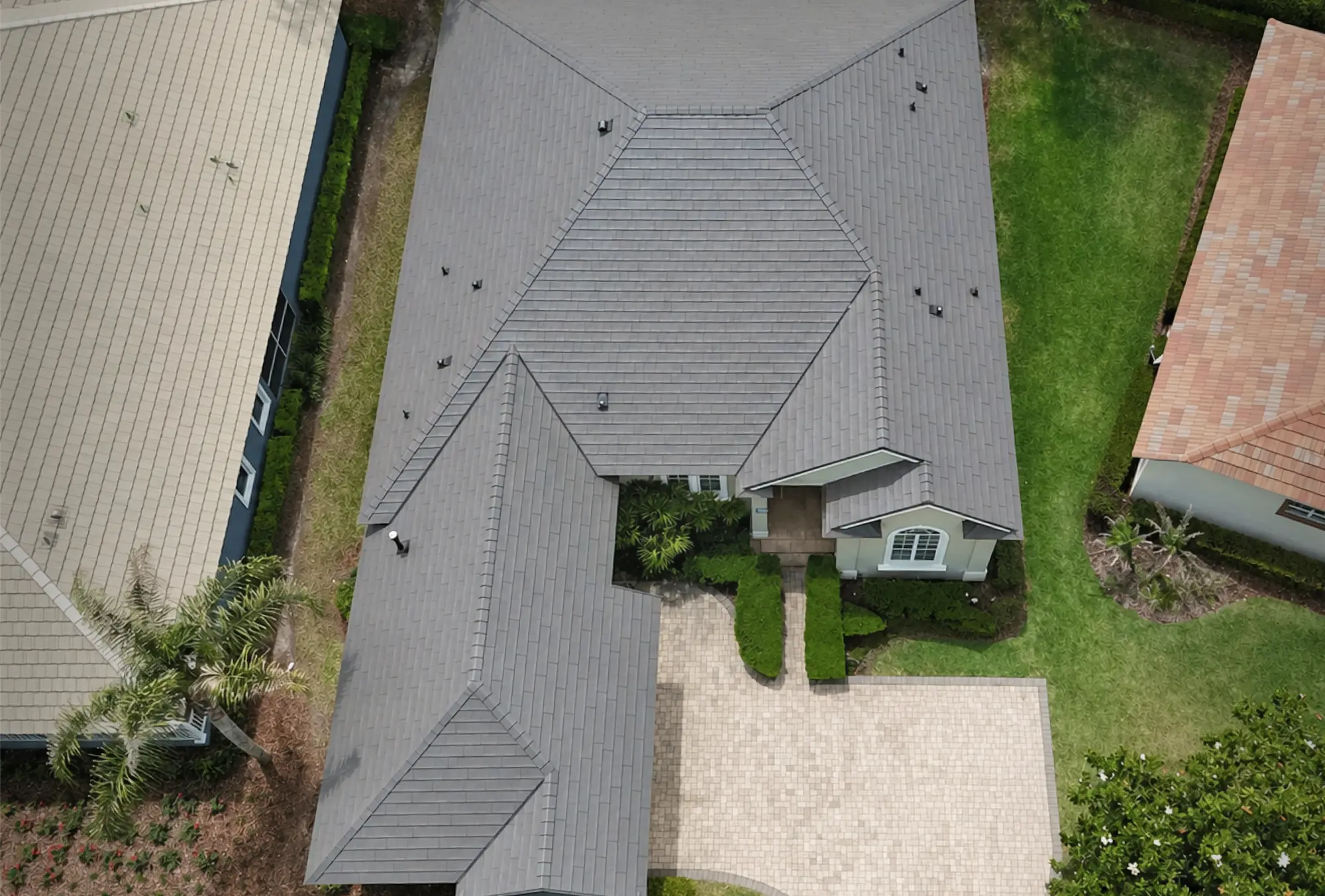 Aerial view of a large home with a Metlok roof