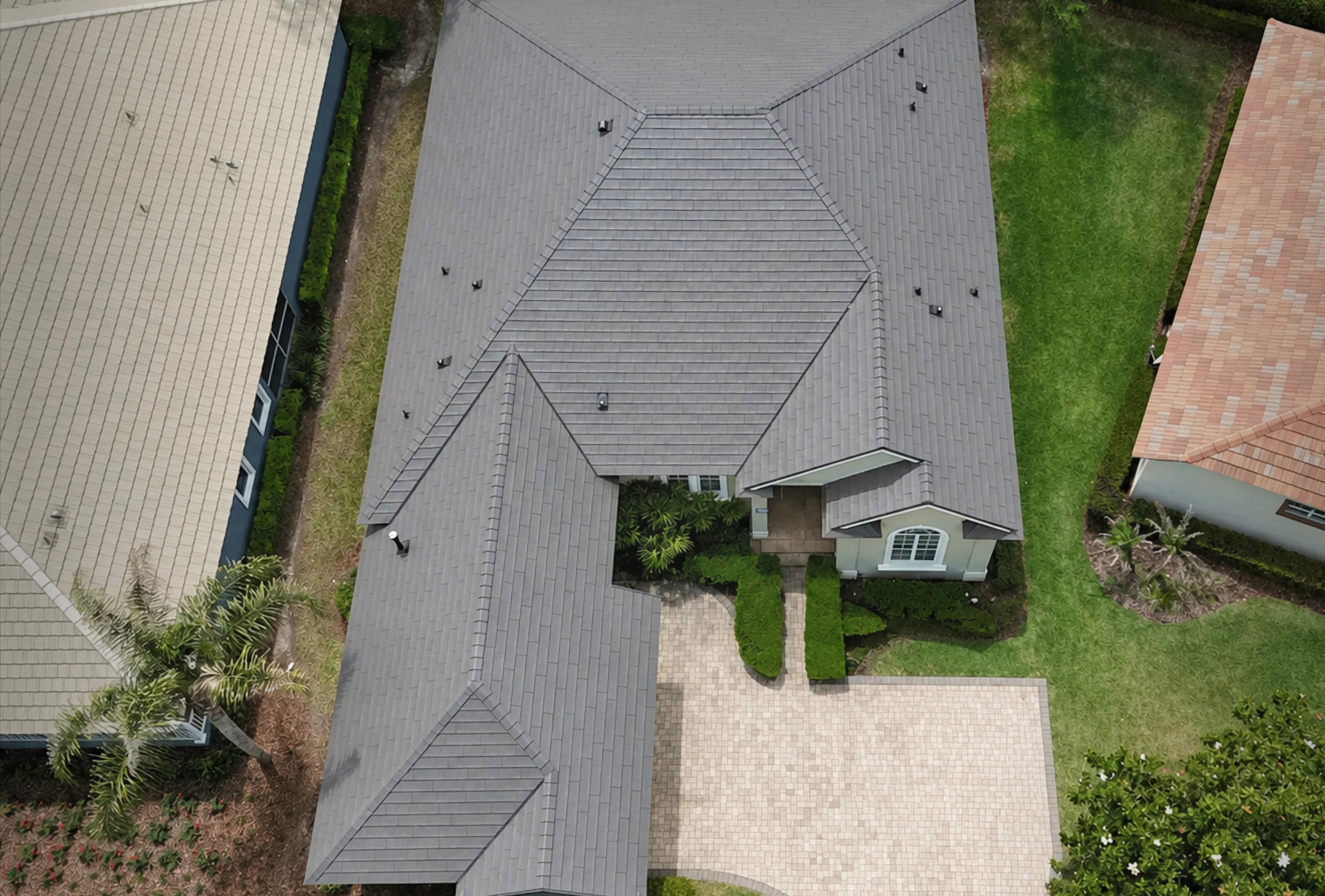 Aerial view of a large home with a Metlok roof